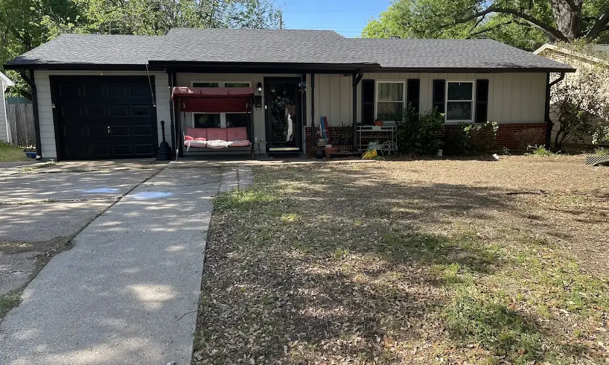 Asphalt Shingle Roof Repair crew at work on a residential roof in Yoakum